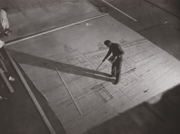 A scenic lays out a backing at Ealing Studios in London in 1939 for the film "Young Man's Fancy". National Media Museum