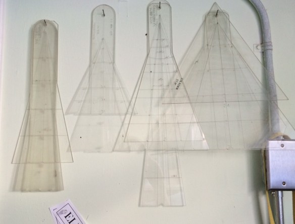 Some of my collection of traditional studio lens angle templates. The ones on the left are for long lenses while the ones on the right are wide-angle lens. The third from the left is a zoom lens template.